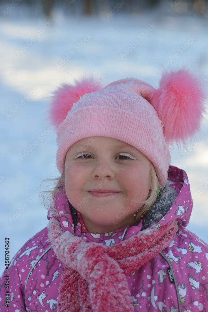 A girl walks through a winter snow-covered forest
A girl walks through a winter snow-covered forest