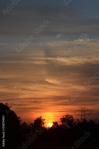 Amazing Sunrise with mountains forests and clouds with Blue orange saffron golden sky