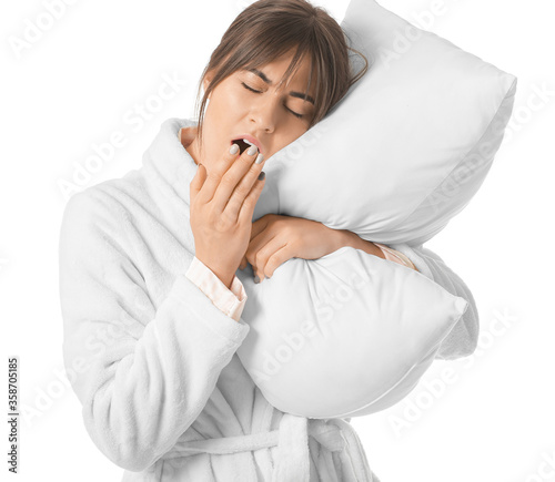 Tired woman with pillow on ...