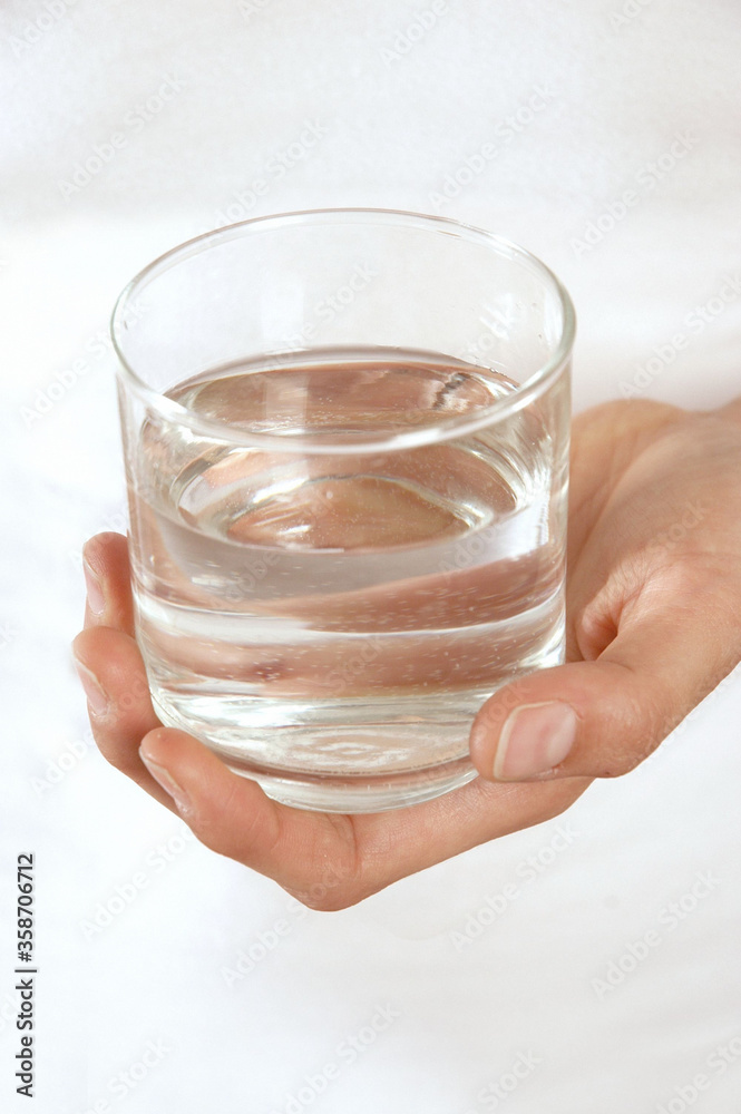 Woman holding glass of water Woman holding glass of water