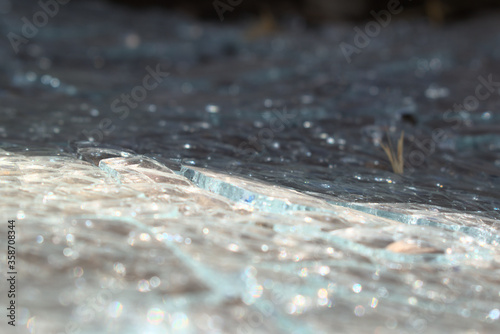 shattered glass close up with metal frame