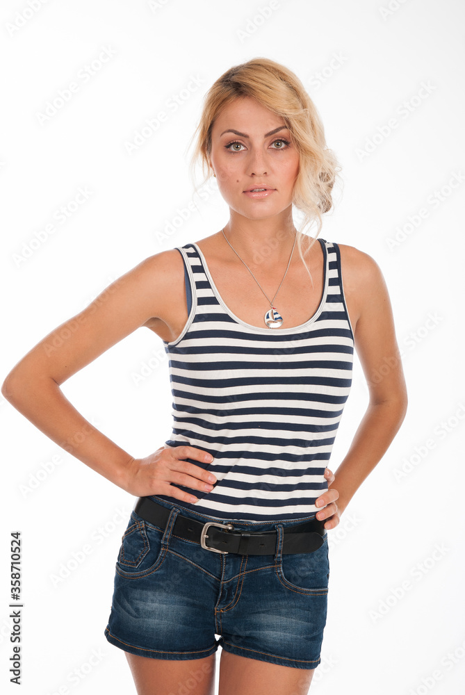 Portrait of a beautiful fashion girl in a striped T-shirt isolated over Portrait of a beautiful fashion girl in a striped T-shirt isolated over