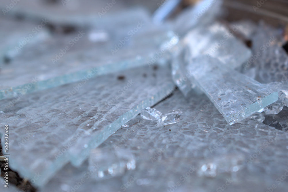 shattered glass close up with metal frame shattered glass close up with metal frame