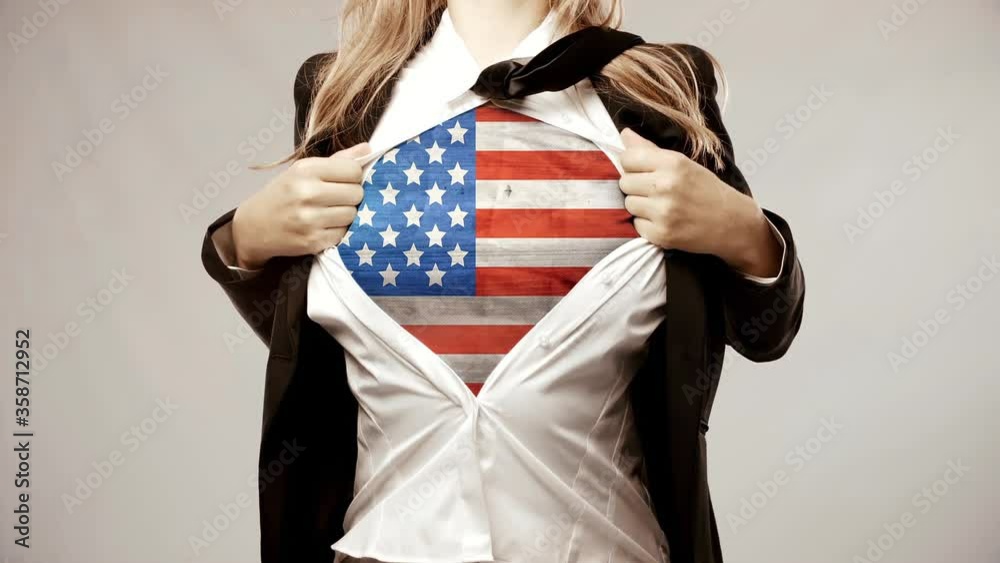 Conceptual video to promote patriotism. Female tears her shirt open to show a print of the American flag for 4th of July Celebration