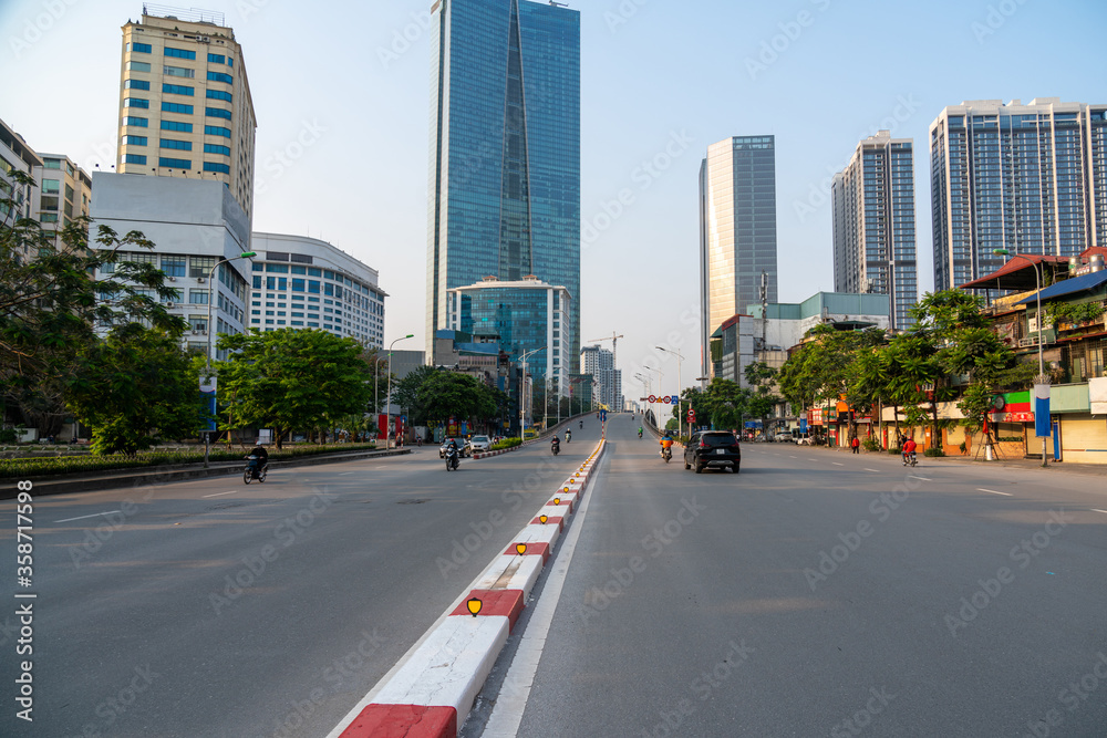 Hanoi cityscape with modern buildings on Nguyen Chi Thanh street at late evening