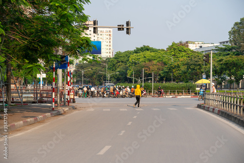 Hanoi street with a woman walking on street