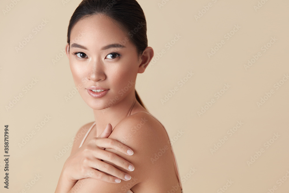 Perfect Asian Nude Models - Woman. Asian Model Beauty Portrait. Beautiful Female Touches Her Shoulder  And Looking At Camera. Tender Girl With Perfect Glowing Skin And Nude  Natural Makeup Posing Against Beige Background. Photos | Adobe Stock