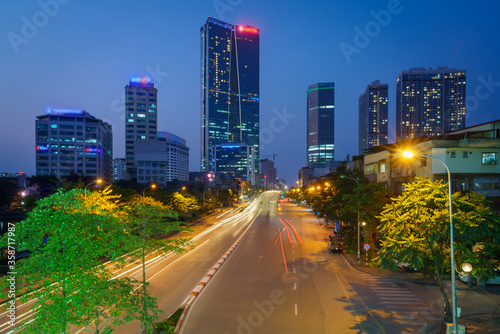Hanoi cityscape with modern buildings on Nguyen Chi Thanh street at twilight