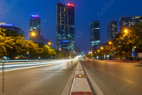 Hanoi cityscape with modern buildings on Nguyen Chi Thanh street at twilight
