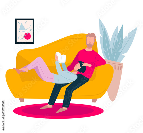Couple spending time at home, reading woman and man