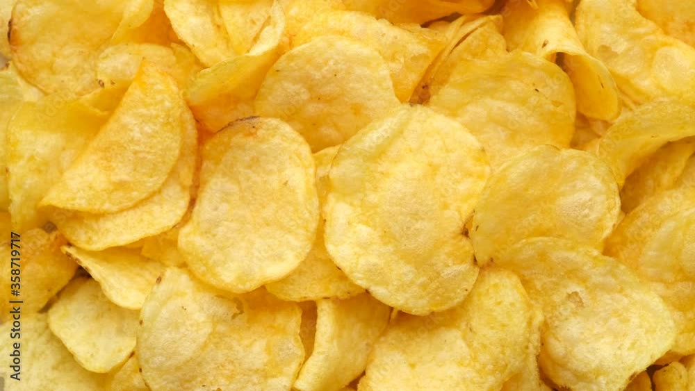 craft golden potato chips rotating close up craft golden potato chips rotating close up