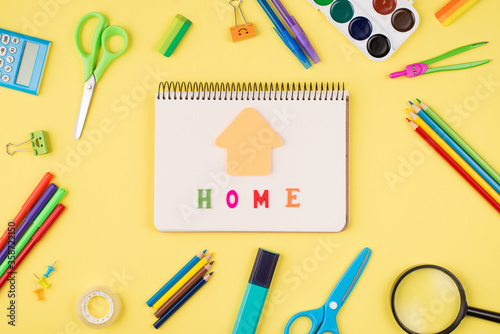 Social distancing concept. Top above overhead view photo of notebook colorful stationery isolated on yellow background