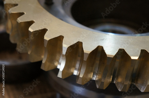 Factory Industrial of brass gear machinery. Metal Gear wheels. Machine part. Closeup