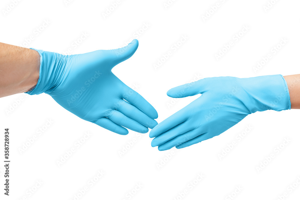 Handshake of two hands in protective medical gloves during the coronavirus outbreak and pandemic. Handshake of two hands in protective medical gloves during the coronavirus outbreak and pandemic.