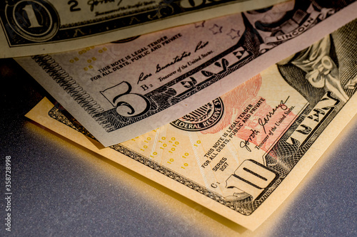 Fotografie close up of a variation of different denominations of fiat money, legal tender o