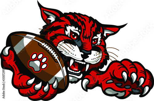 wildcat football mascot holding ball in claw for school, college or league photo