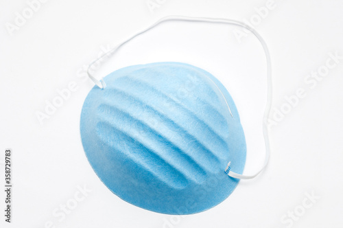 Blue coronavirus protective mask on white background