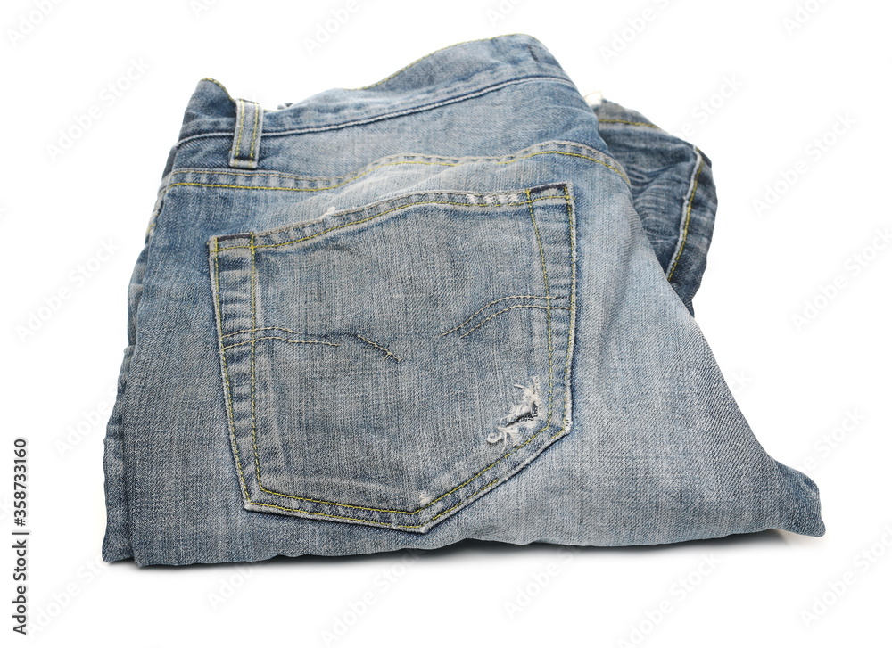 Old pair of blue jeans, denim pants isolated on white background Old pair of blue jeans, denim pants isolated on white background