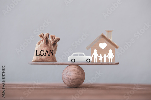Canvas Print Loan bags with family member and car in a house on balance scale