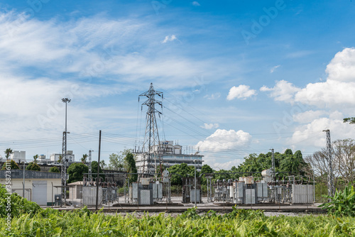 Kuching, Sarawak / Malaysia - June 21, 2016: Power substaion surrounded by bush in daylight.