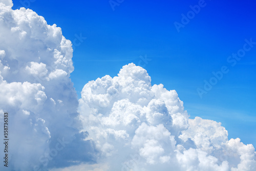 White cumulus clouds on clear blue sky background close up, beautiful aerial cloudscape view, azure skies backdrop, fluffy cloud texture, sunny heaven, cloudy weather, cloudiness landscape, copy space photo