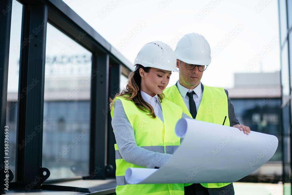 Man and woman discussing work. Colleagues working on project. Man and woman discussing work. Colleagues working on project.
