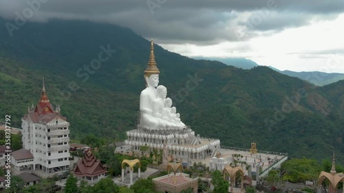 Aerial View of White Five Sitting Buddhas Statue in Wat Pha Sorn Kaew Buddhist Monastery Complex, Thailand photo