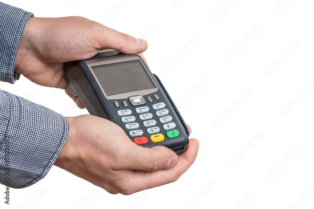 Payment terminal in hand of man isolated on white Payment terminal in hand of man isolated on white