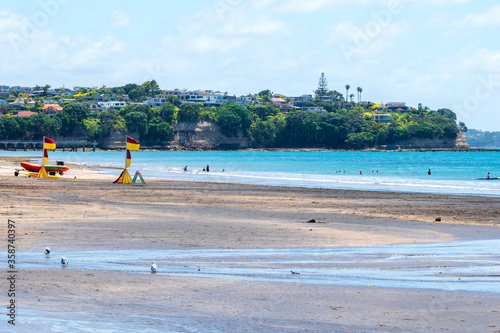 Landscape View of Mairangi Bay Beach Auckland, New Zealand; Place for Picnic and Relaxing photo