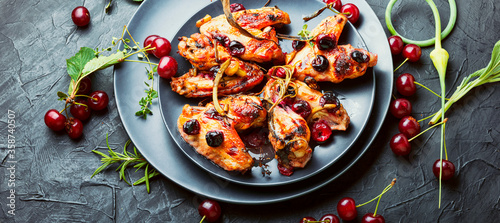 Chicken wings with cherries.