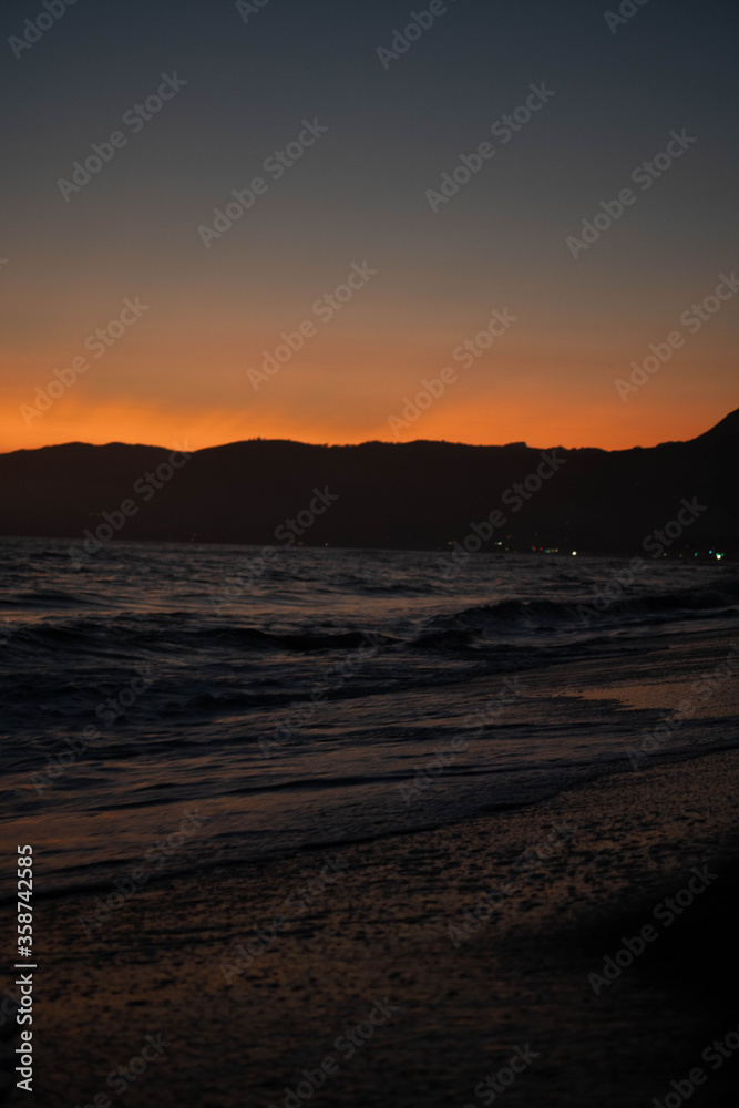 la-palms-beach-sunset-cloudy-waves-pier