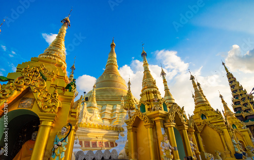 YANGON,MYANMAR-MAY 15.2020: Buddhist Pilgrims in the Shwedagon Pagoda at night. It is the most sacred Buddhist pagoda for the Burmese.