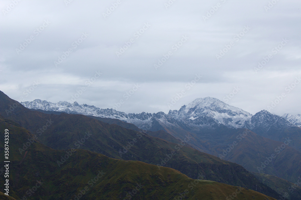 lower Himalayan mountain range with snow and clouds