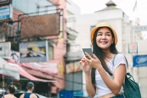 Photography Traveler asian woman with mobile phone travel in bangkok city Thailand