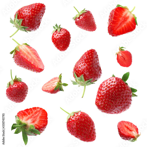 Fototapeta Naklejka Na Ścianę i Meble -  Set with ripe strawberries falling on white background