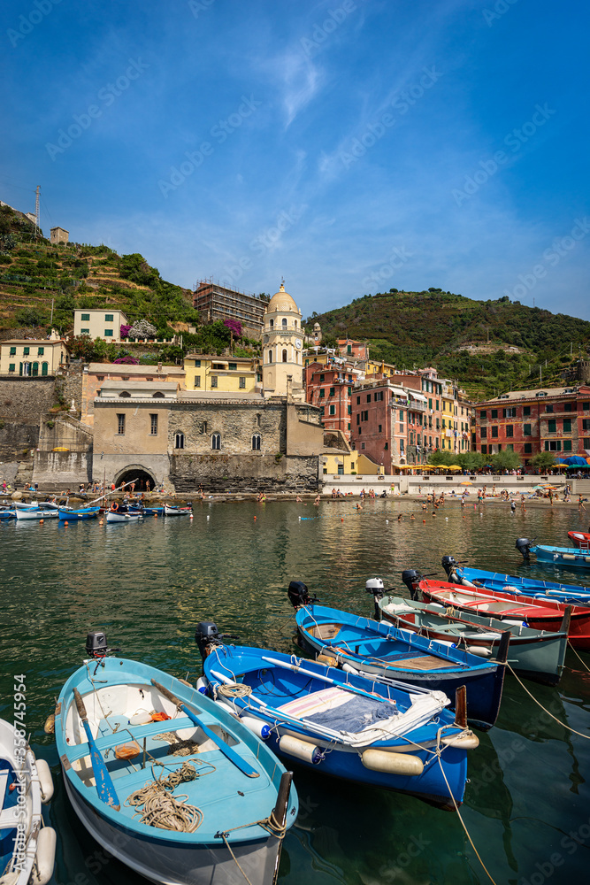 Ancient village of Vernazza with the boats in the harbor. Cinque Terre, National park in Liguria, La Spezia province, Italy, Europe. UNESCO world heritage site