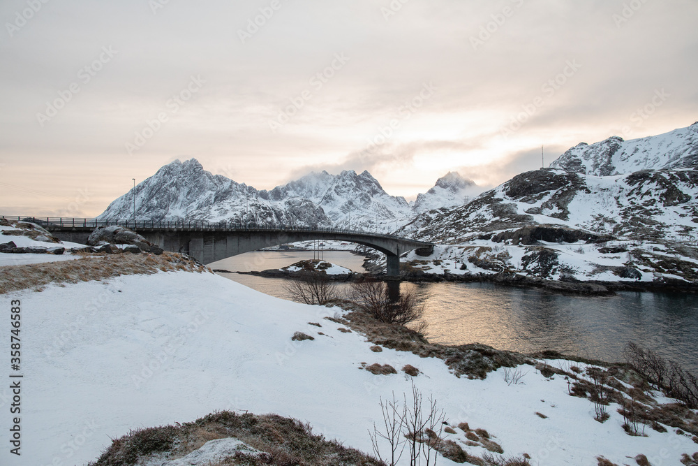 Fototapeta premium A mountain bridge at sunset in the Lofoten islands. 
