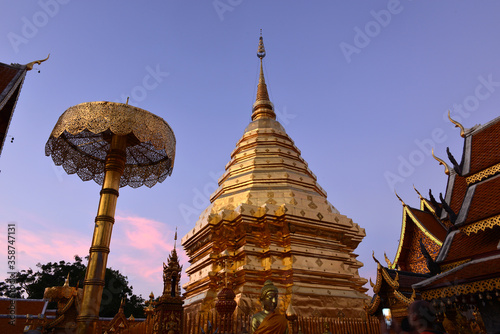 Golden pagoda at Wat Phra That Doi Suthep with beautiful twilight background. The popular tourist attraction in Chiang Mai  Thailand.