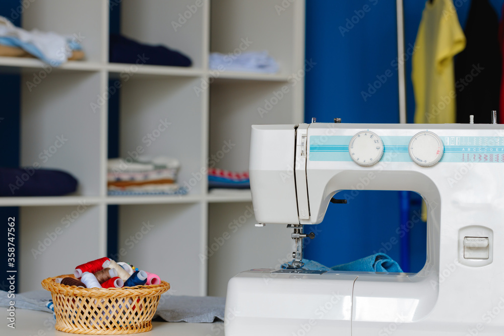 Electric sewing machine in a seamstress office