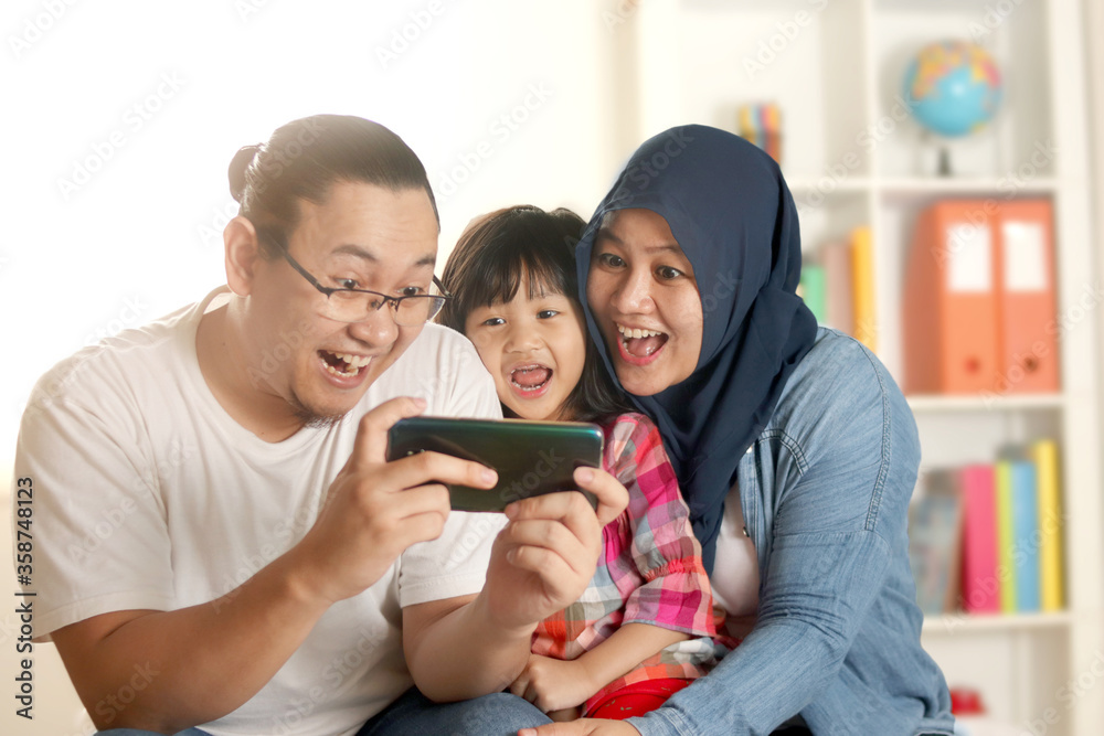 Hooked on Phone. Family Play Mobile Phone Game at Home. Staying Connected  with Cell Phone. Family Communication Stock Photo - Image of beard, baby:  180857330