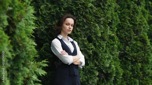 Businesswoman outdoors portrait. Woman in the city park