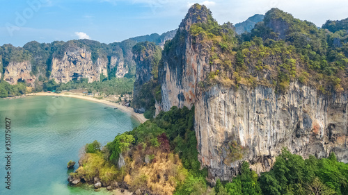 Railay beach in Thailand  Krabi province  aerial bird s view of tropical Railay and Pranang beaches with rocks and palm trees  coastline of Andaman sea from above 