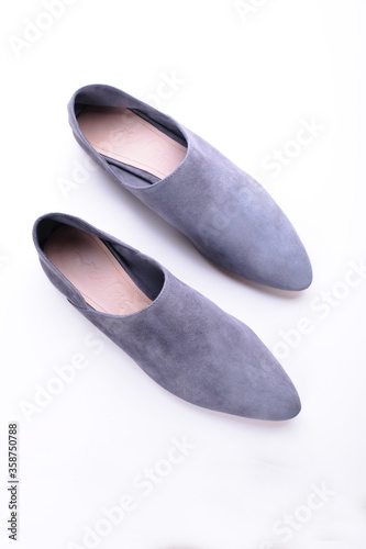 urban gray loafers, modern casual women’s flat shoes, classic, suede mules and loafers, leather substitute, stylish on a white background, studio