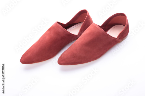 terracotta or peach loafers, modern casual women’s flat shoes, classic, suede mules and loafers, leather substitute, stylish on a white background, studio