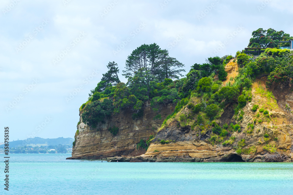 Headland and Panoramic View of Eastern Beach, Auckland New Zealand during High Tide Time Headland and Panoramic View of Eastern Beach, Auckland New Zealand during High Tide Time