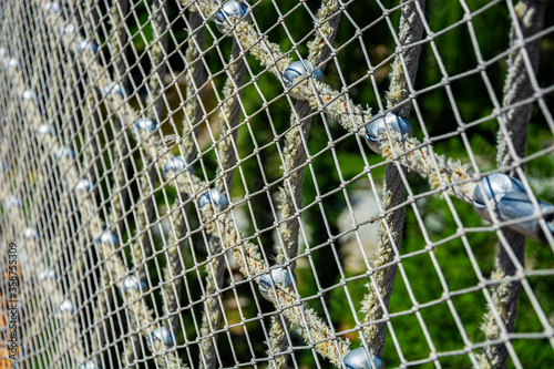 Net on thick rope, on green background