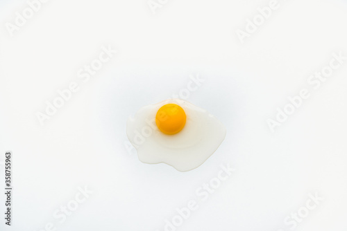 Bild auf Leinwand chicken yolk on a white plate, chicken eggs on a white plate, chicken yolk