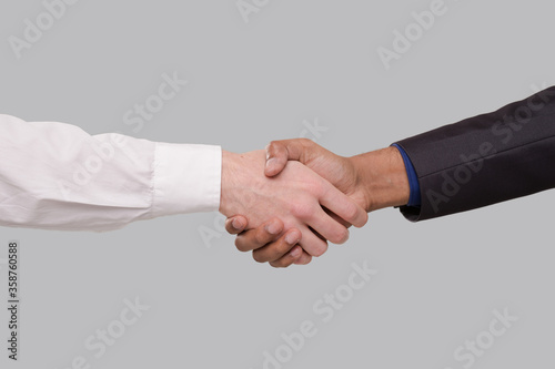 Hand Shake White and Black Businessmen. International Friendship hand shake. Black Lives Matter
