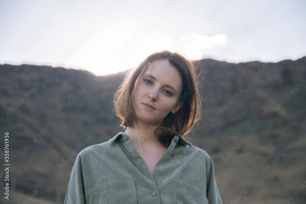 young woman in the mountains