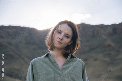 young woman in the mountains